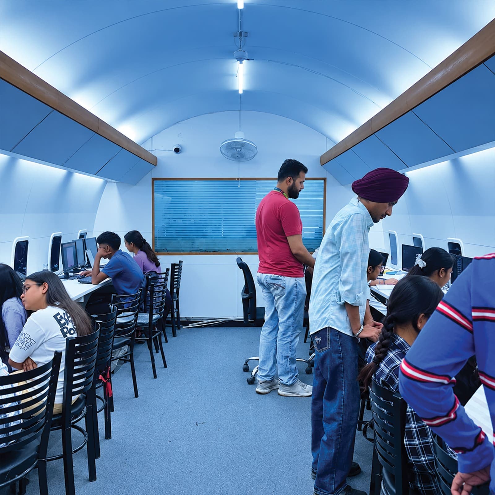 Mentors on the floor in the aircraft lab